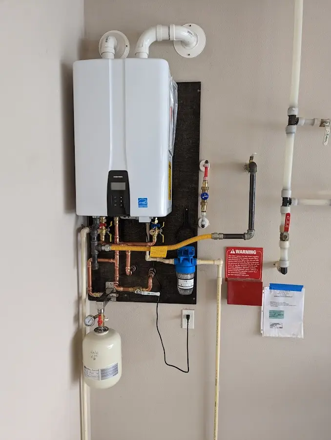 Professional plumber installing copper piping in a Livermore home